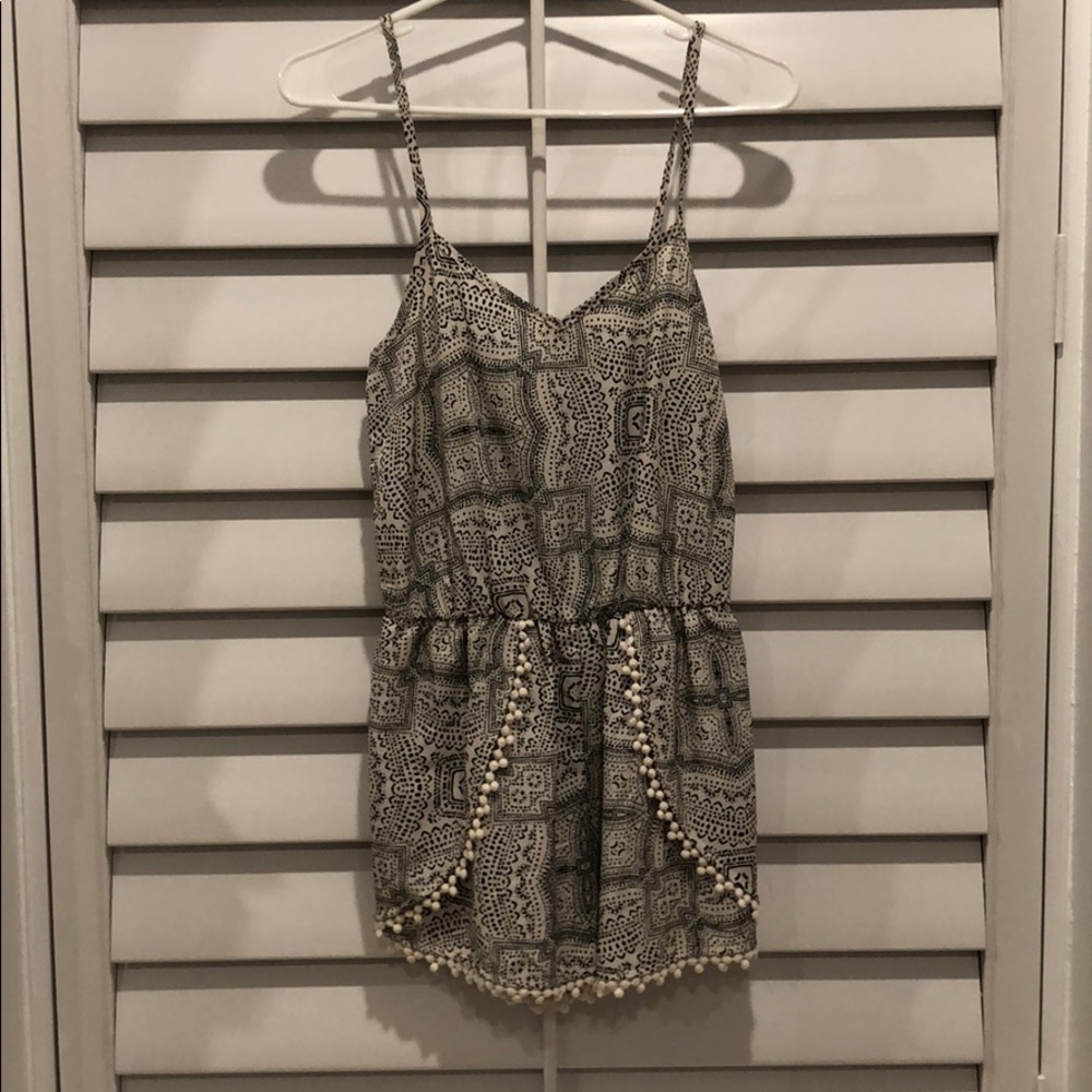 Black and white romper with Pom Pom detail!